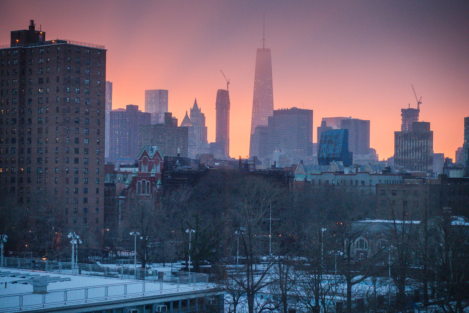 The view from my apartment in the East Village, NYC. Early January 2015, capturing a bright sunset after a few days of snowfall.