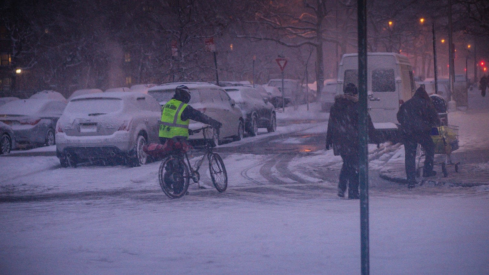 A food delivery guy bracing the cold during the first blizzard of the season. 1st Ave, New York City, Jan 2015.
